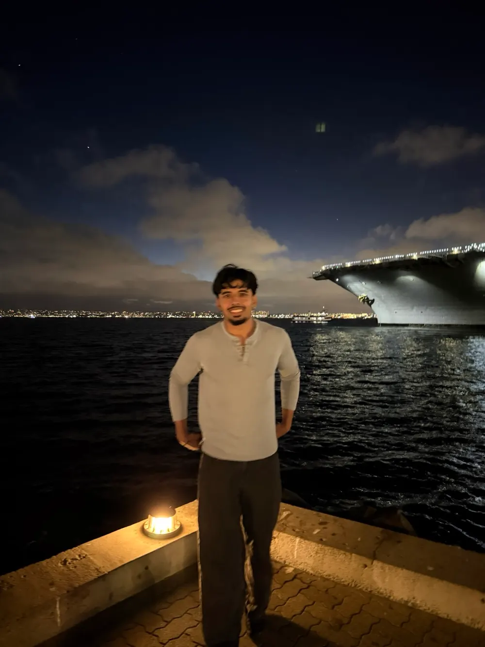 Kartikey on a waterfront at night